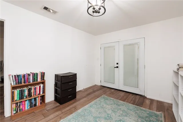 a view of a livingroom with a book shelf