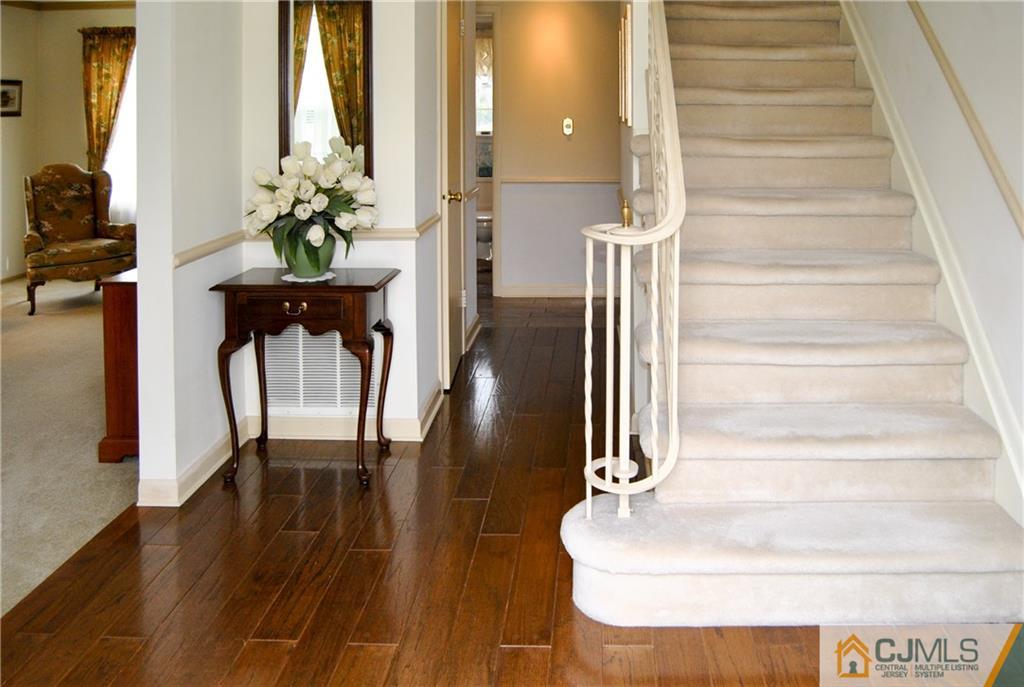 18 Krebs Road Plainsboro, NJ 08536 - Photo 2 of 24 a view of entryway and hall with wooden floor