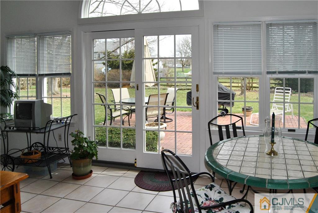 18 Krebs Road Plainsboro, NJ 08536 - Photo 12 of 24 a view of a dining room with furniture window and outside view