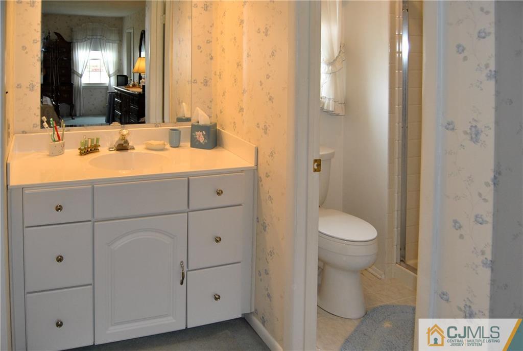 18 Krebs Road Plainsboro, NJ 08536 - Photo 14 of 24 a bathroom with a sink and a mirror
