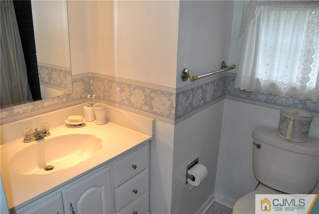 18 Krebs Road Plainsboro, NJ 08536 - Photo 17 of 24 a bathroom with a sink and a mirror