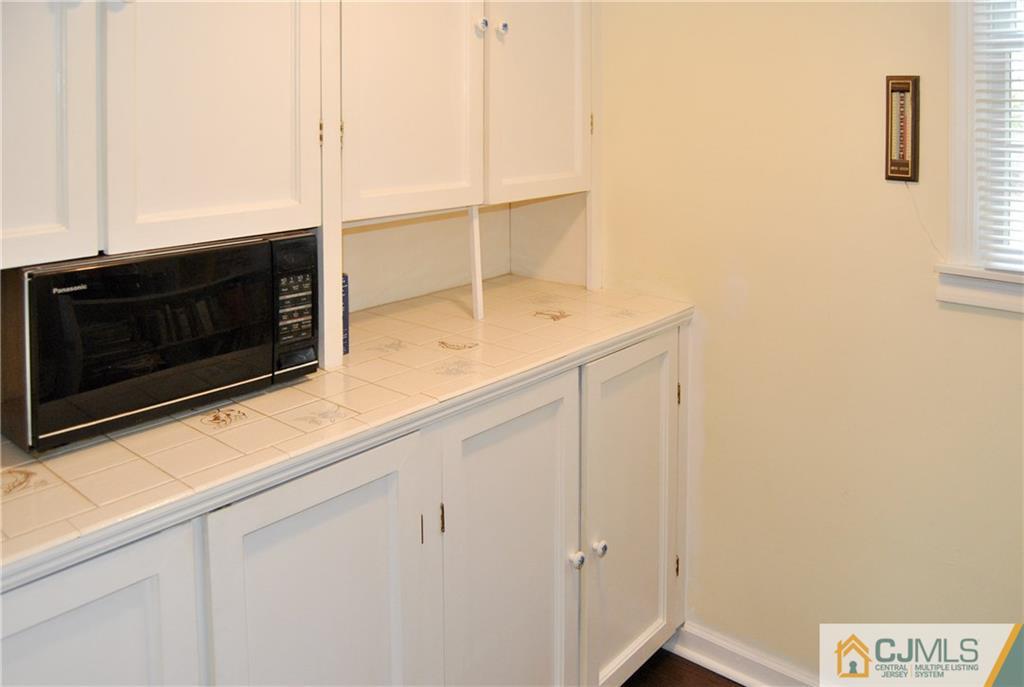 18 Krebs Road Plainsboro, NJ 08536 - Photo 24 of 24 a bathroom with a sink and a microwave