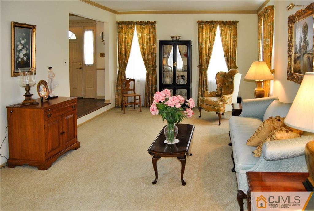 18 Krebs Road Plainsboro, NJ 08536 - Photo 4 of 24 a living room with furniture and a large window