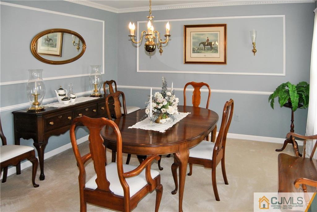 18 Krebs Road Plainsboro, NJ 08536 - Photo 5 of 24 a view of a dining room with furniture and chandelier