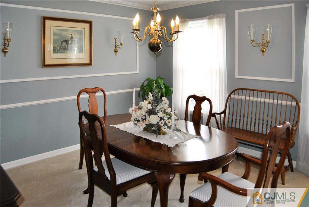 18 Krebs Road Plainsboro, NJ 08536 - Photo 6 of 24 a view of a dining room with furniture and chandelier