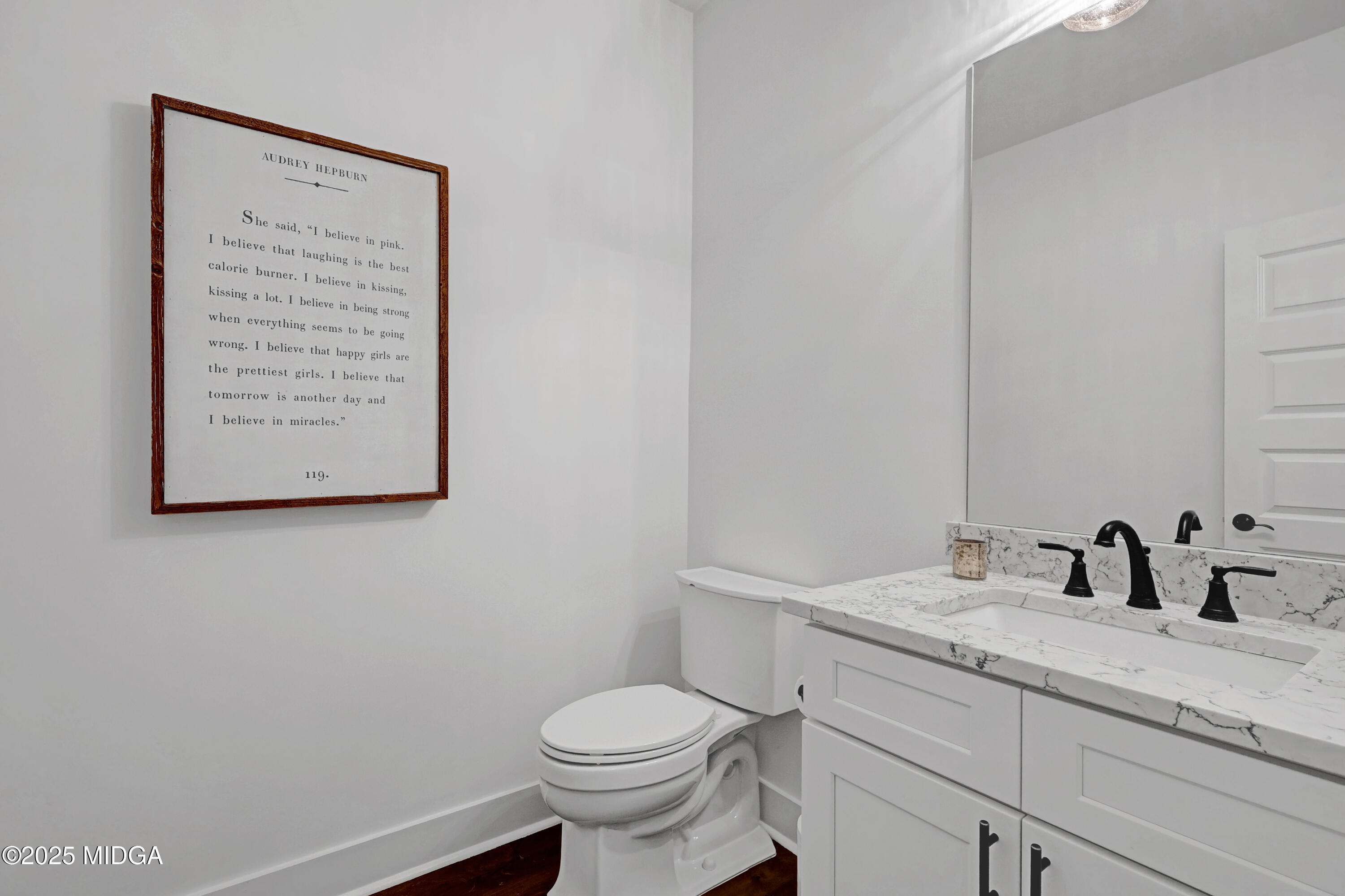 205 Chastain Drive Forsyth, GA 31029 - Photo 11 of 72 a bathroom with a granite countertop toilet sink and mirror