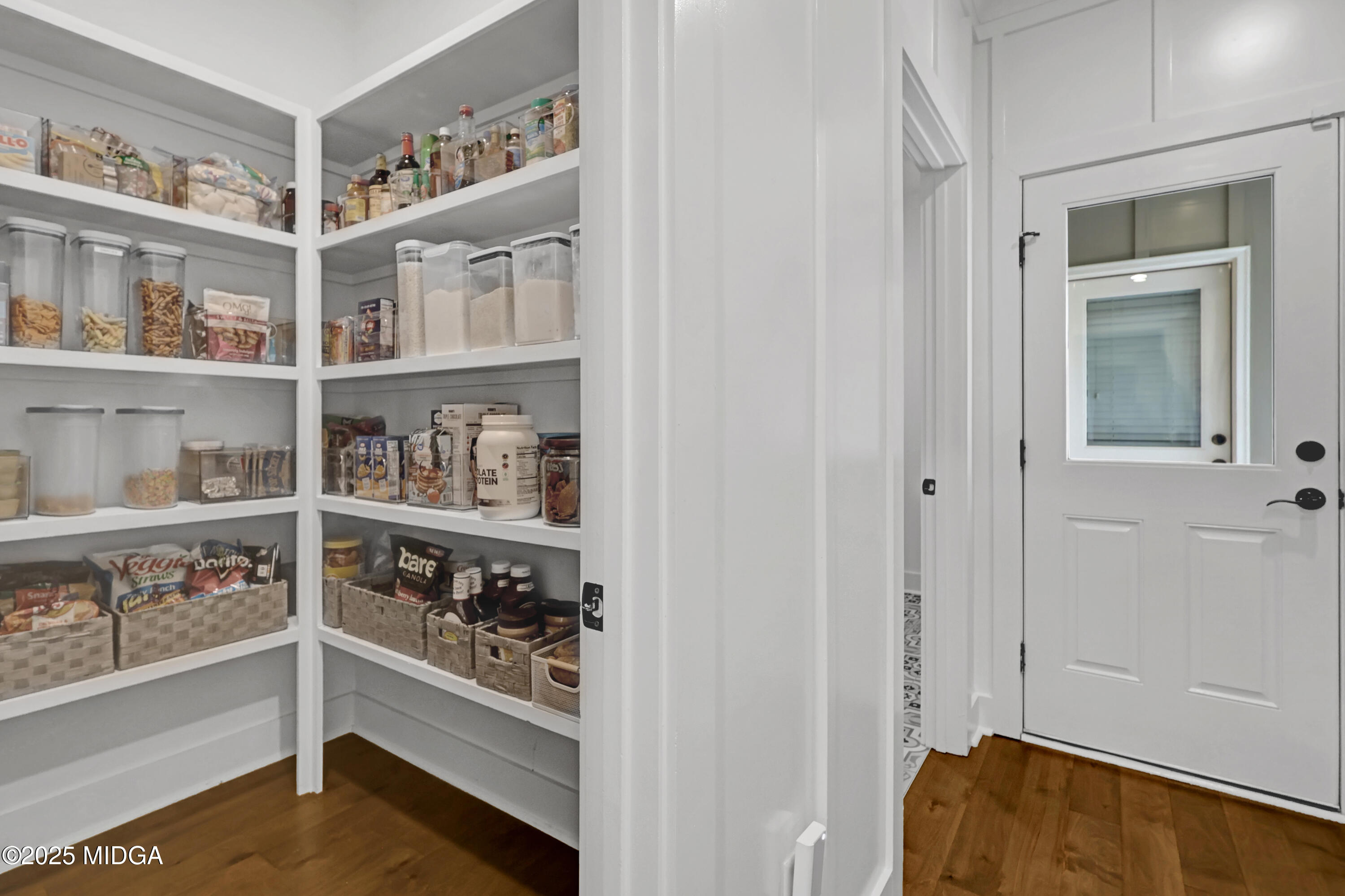 205 Chastain Drive Forsyth, GA 31029 - Photo 27 of 72 a view of walk in closet with clothes and shoes