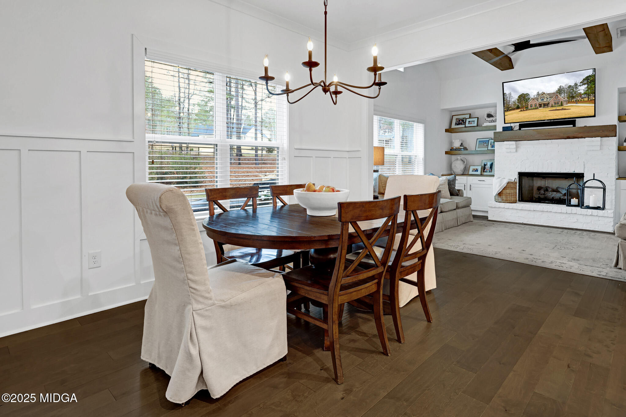 205 Chastain Drive Forsyth, GA 31029 - Photo 36 of 72 a dining room with furniture a fireplace and wooden floor