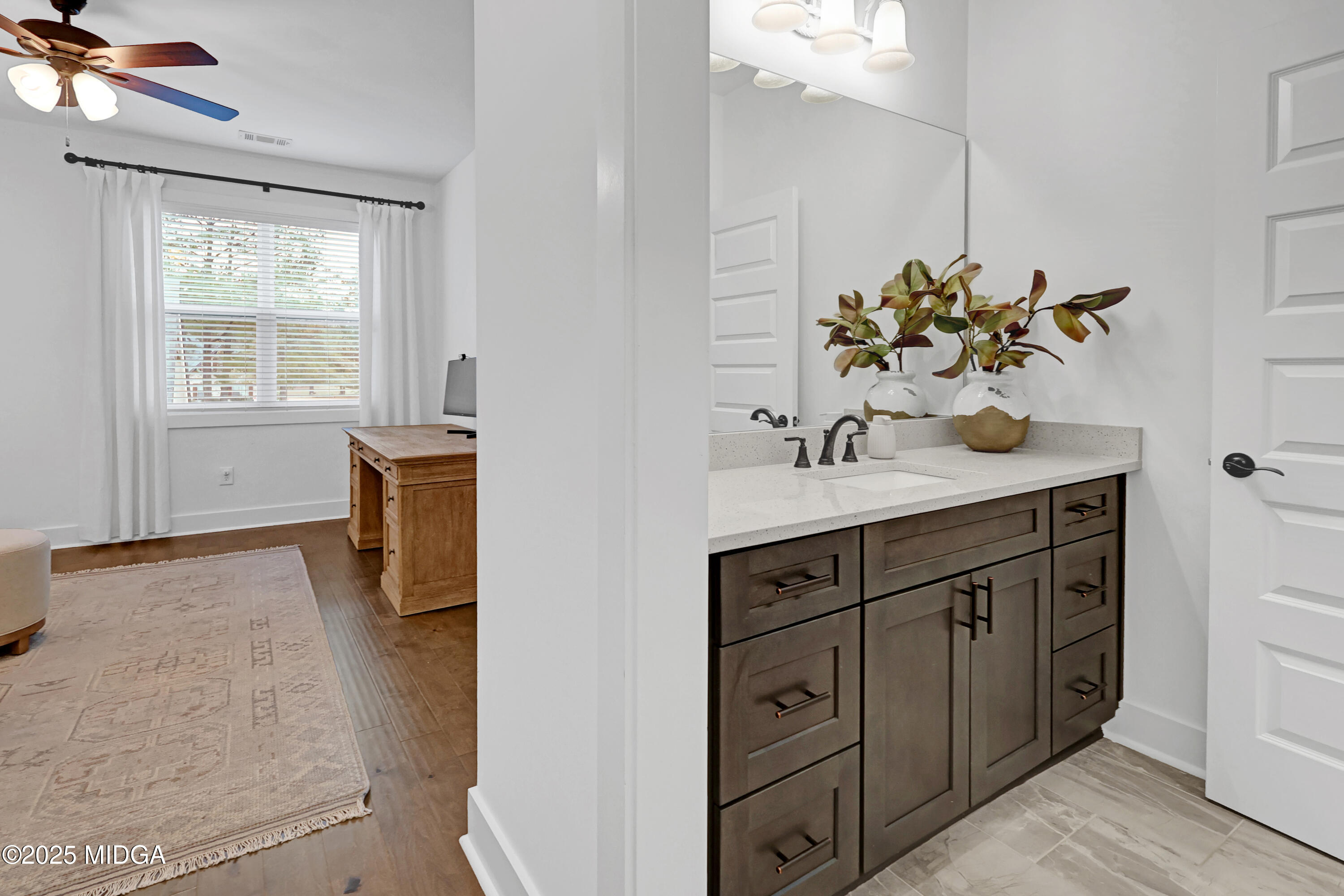 205 Chastain Drive Forsyth, GA 31029 - Photo 48 of 72 a bathroom with a sink and a mirror