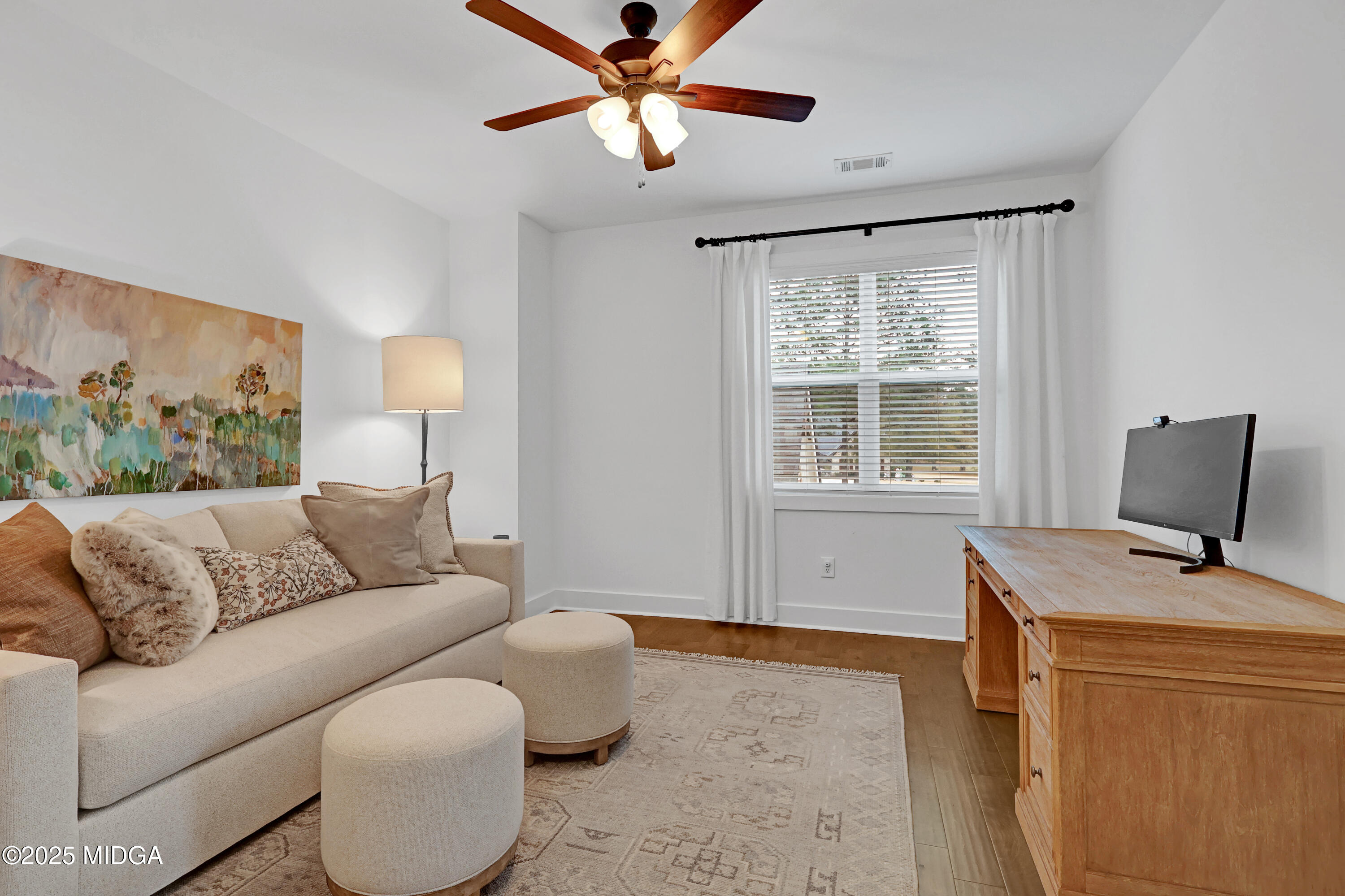 205 Chastain Drive Forsyth, GA 31029 - Photo 49 of 72 a living room with furniture and a window
