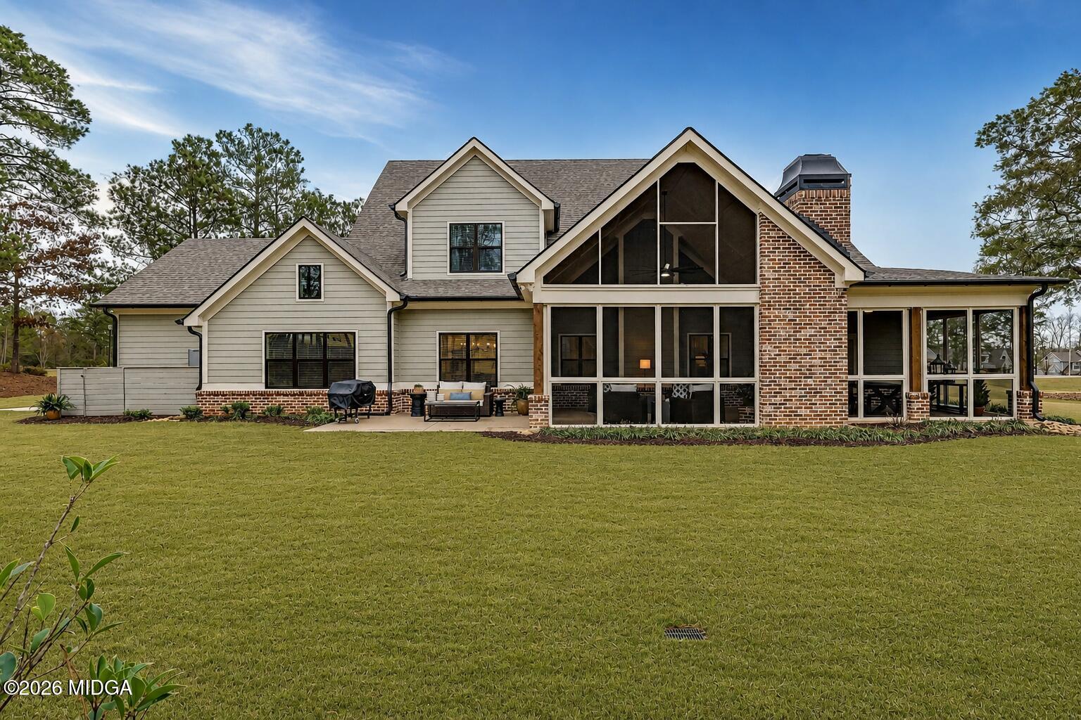 205 Chastain Drive Forsyth, GA 31029 - Photo 62 of 72 a front view of a house with a garden