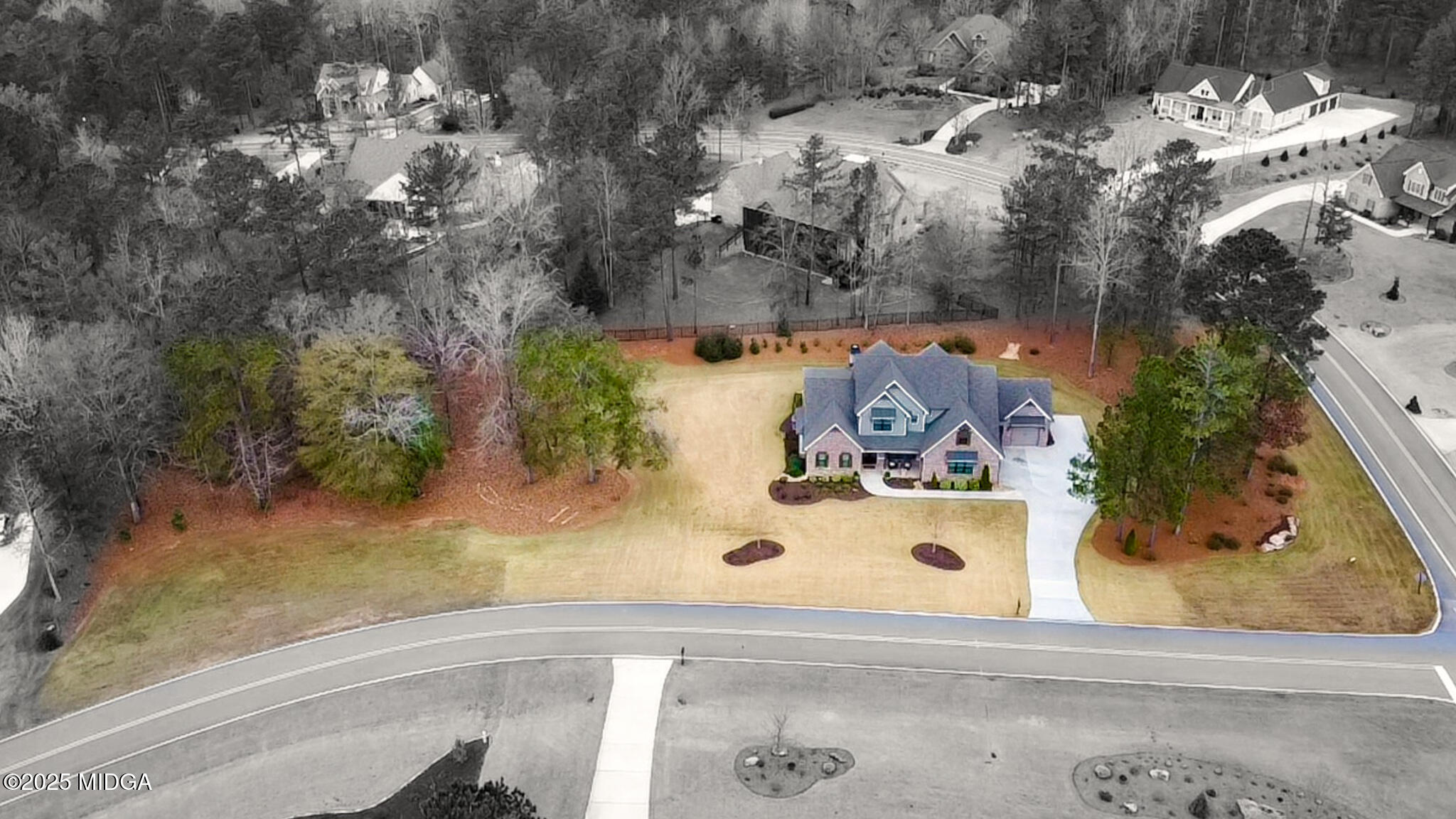205 Chastain Drive Forsyth, GA 31029 - Photo 64 of 72 an aerial view of a house with a yard and large trees