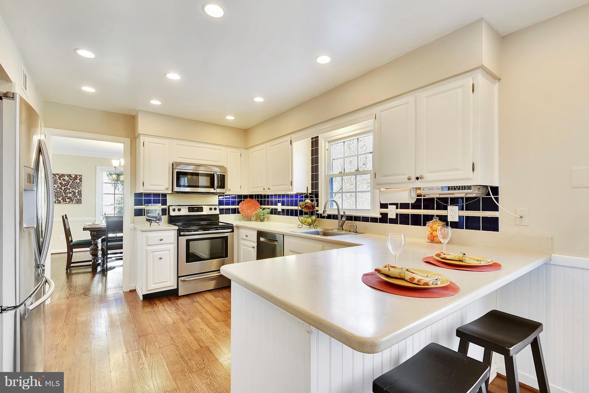 15901 Green Meadow Road North Potomac, MD 20878 - Photo 6 of 30 Kitchen w/ Corian Counter and Stainless Appliances