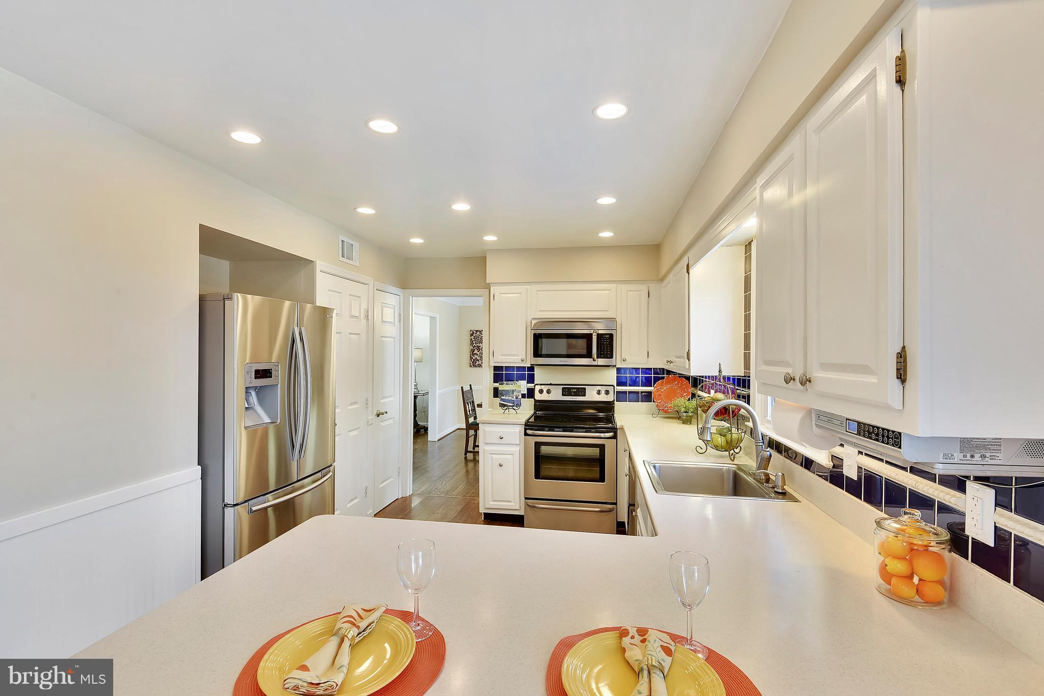 15901 Green Meadow Road North Potomac, MD 20878 - Photo 7 of 30 Kitchen w/ Corian Counter and Stainless Appliances