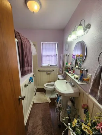 a bathroom with a sink mirror and vanity