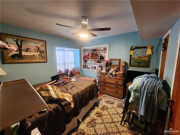 a bed room with a bed and a view of bedroom