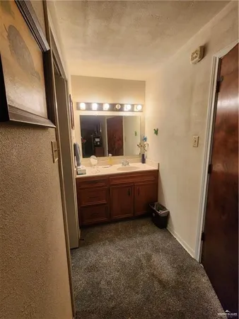 a bathroom with a double vanity sink and mirror