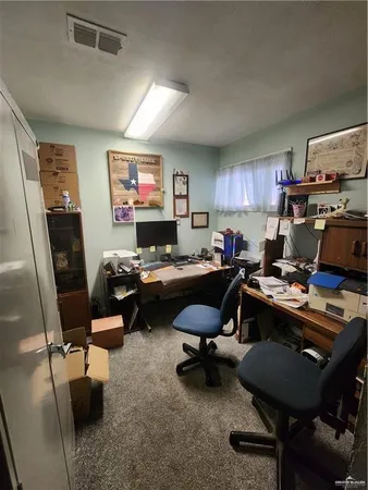 a work room with furniture and a window