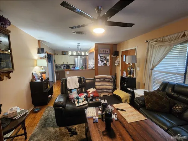 a living room with lots of furniture and gym equipment