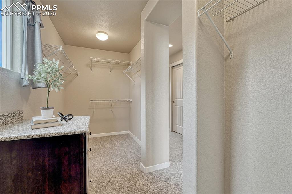 11298 Scenic Brush Drive Peyton, CO 80831 - Photo 25 of 50 a bathroom with a sink vanity granite and a mirror