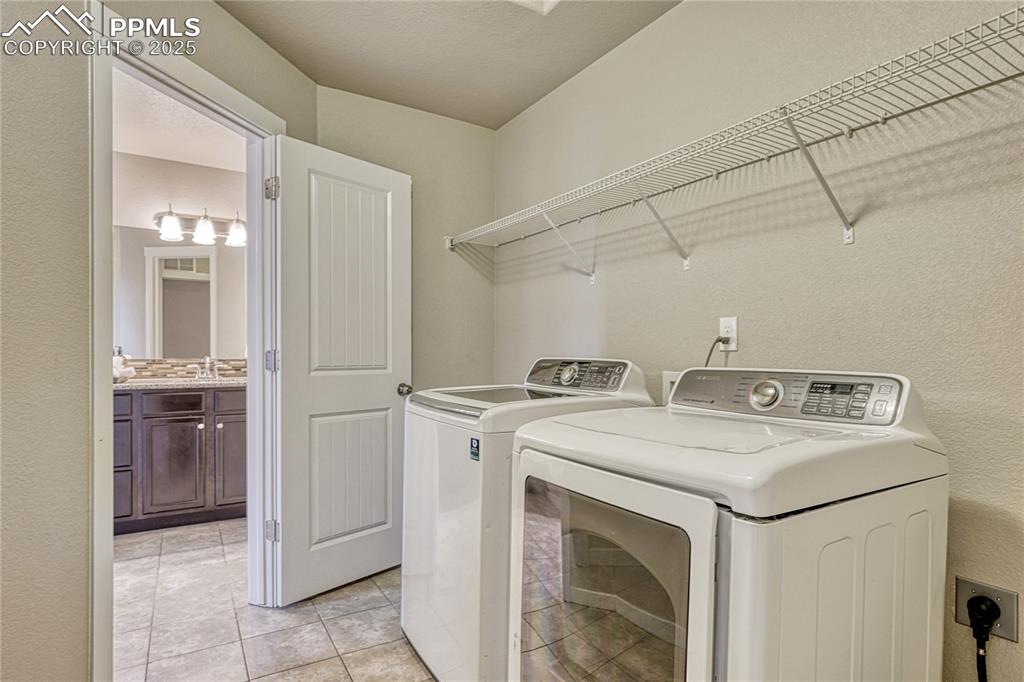 11298 Scenic Brush Drive Peyton, CO 80831 - Photo 26 of 50 a utility room with dryer and washer