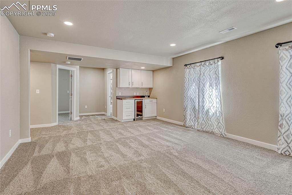 11298 Scenic Brush Drive Peyton, CO 80831 - Photo 39 of 50 a view of empty room with a fireplace