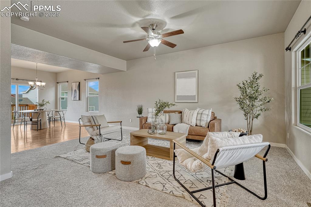 11298 Scenic Brush Drive Peyton, CO 80831 - Photo 4 of 50 a dining room with furniture and wooden floor
