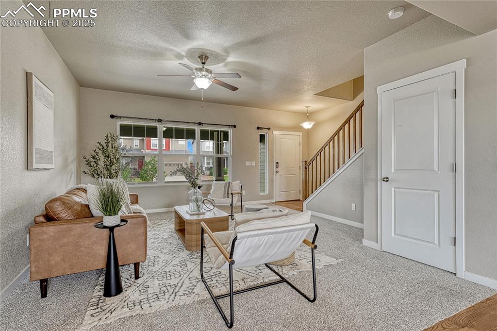 11298 Scenic Brush Drive Peyton, CO 80831 - Photo 6 of 50 a living room with furniture and a window