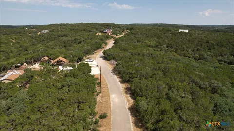 a view of a field with an ocean view