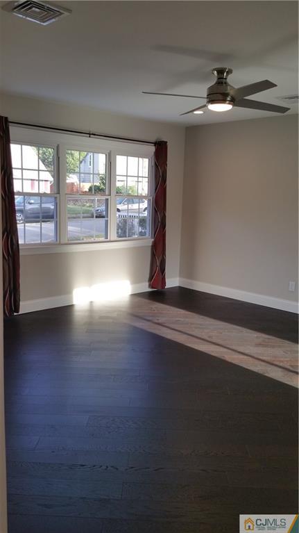 10 Richmond Road Edison, NJ 08817 - Photo 8 of 12 a view of empty room with wooden floor and fan