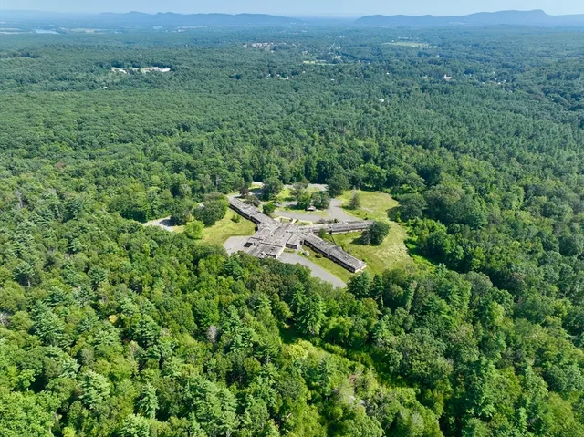 an aerial view of residential house with outdoor space