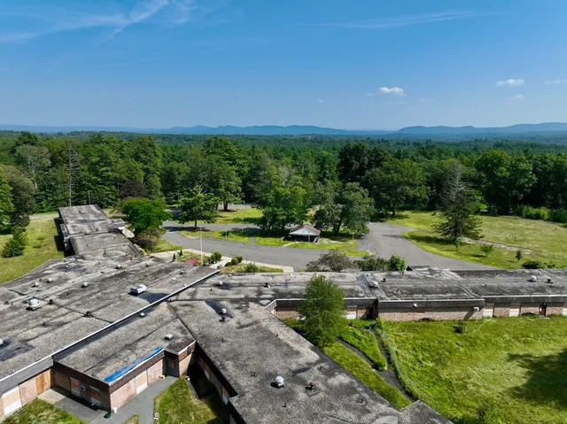 a view of a swimming pool with a yard