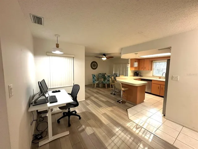 a living room with furniture a dining table and chairs