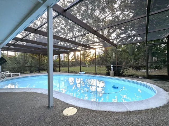 a view of a swimming pool with a patio