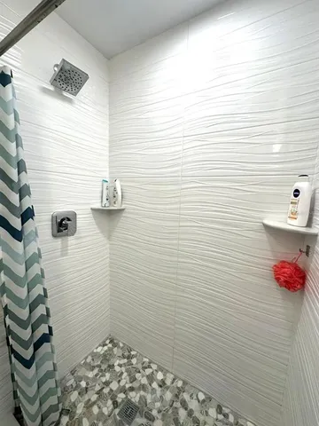 a bathroom with a sink and a shower