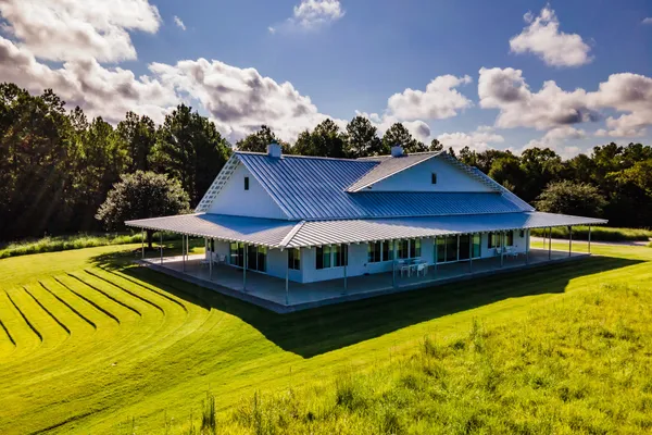 a view of a house with swimming pool