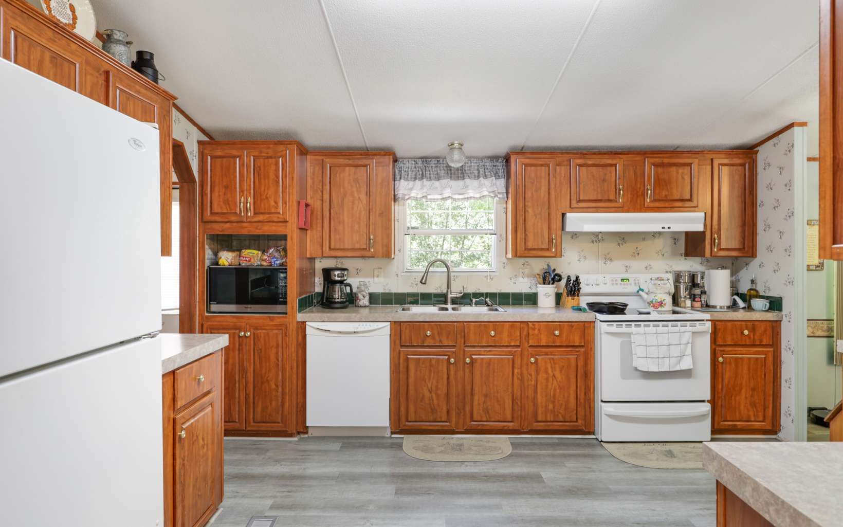 611 Wash Wilson Road Blue Ridge, GA 30513 - Photo 13 of 26 a kitchen with stainless steel appliances granite countertop a stove a sink dishwasher and a refrigerator