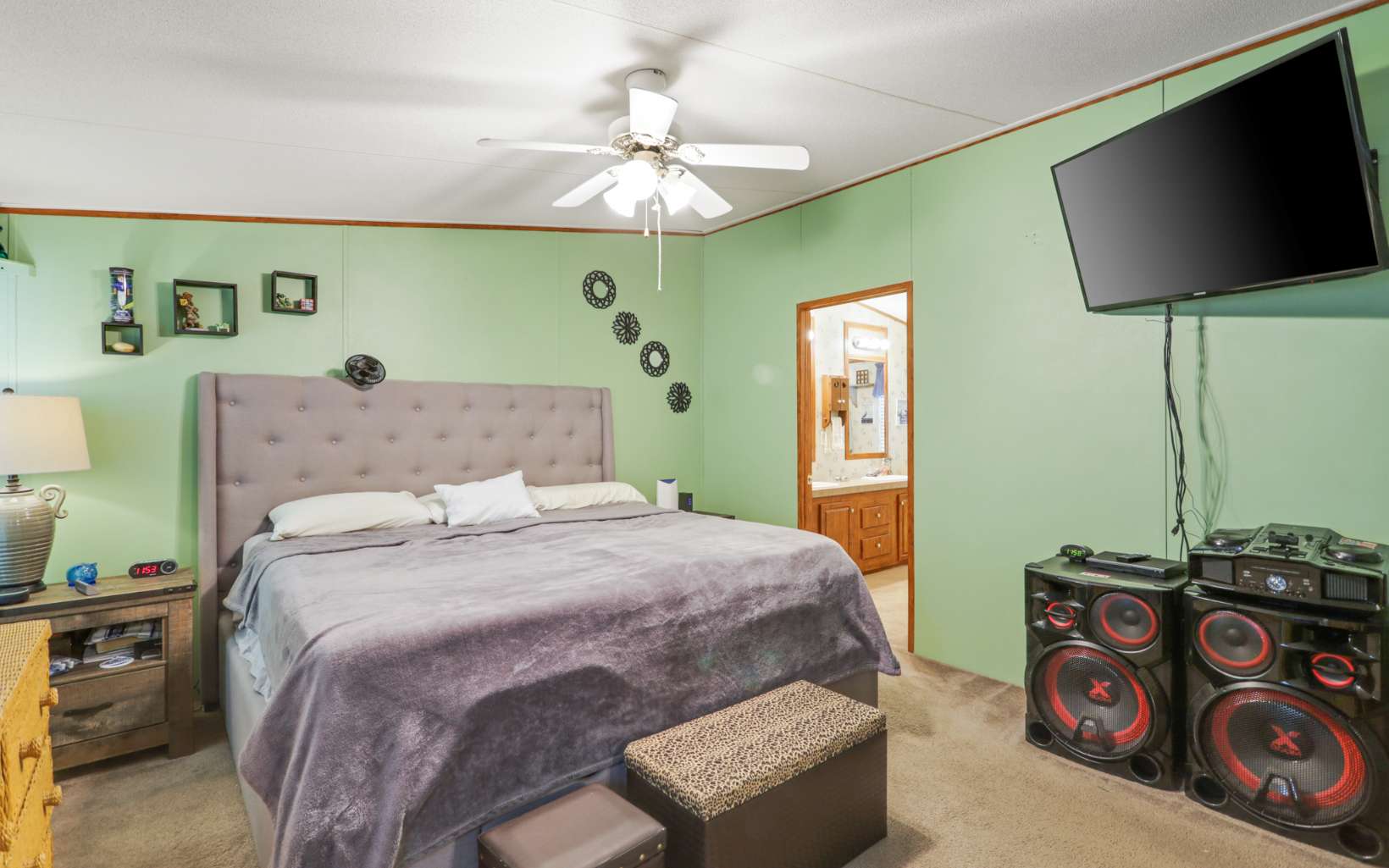 611 Wash Wilson Road Blue Ridge, GA 30513 - Photo 18 of 26 a bedroom with a bed and flat screen tv