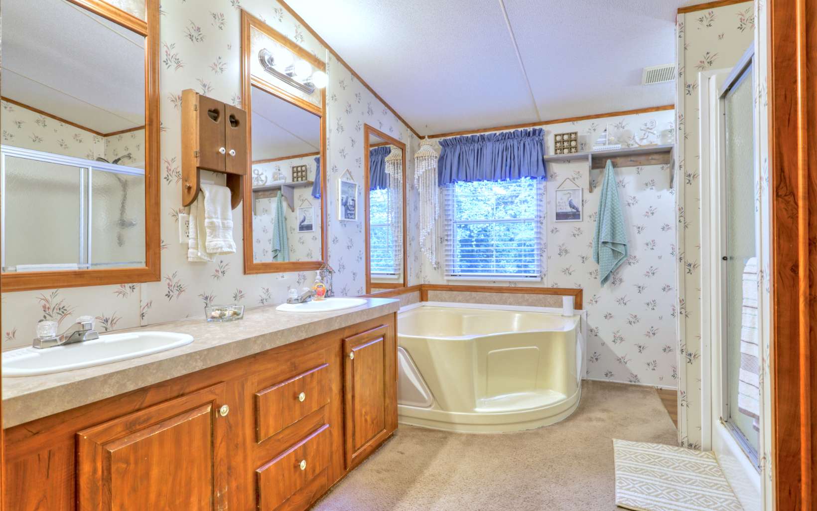 611 Wash Wilson Road Blue Ridge, GA 30513 - Photo 19 of 26 a bathroom with a granite countertop sink and a mirror