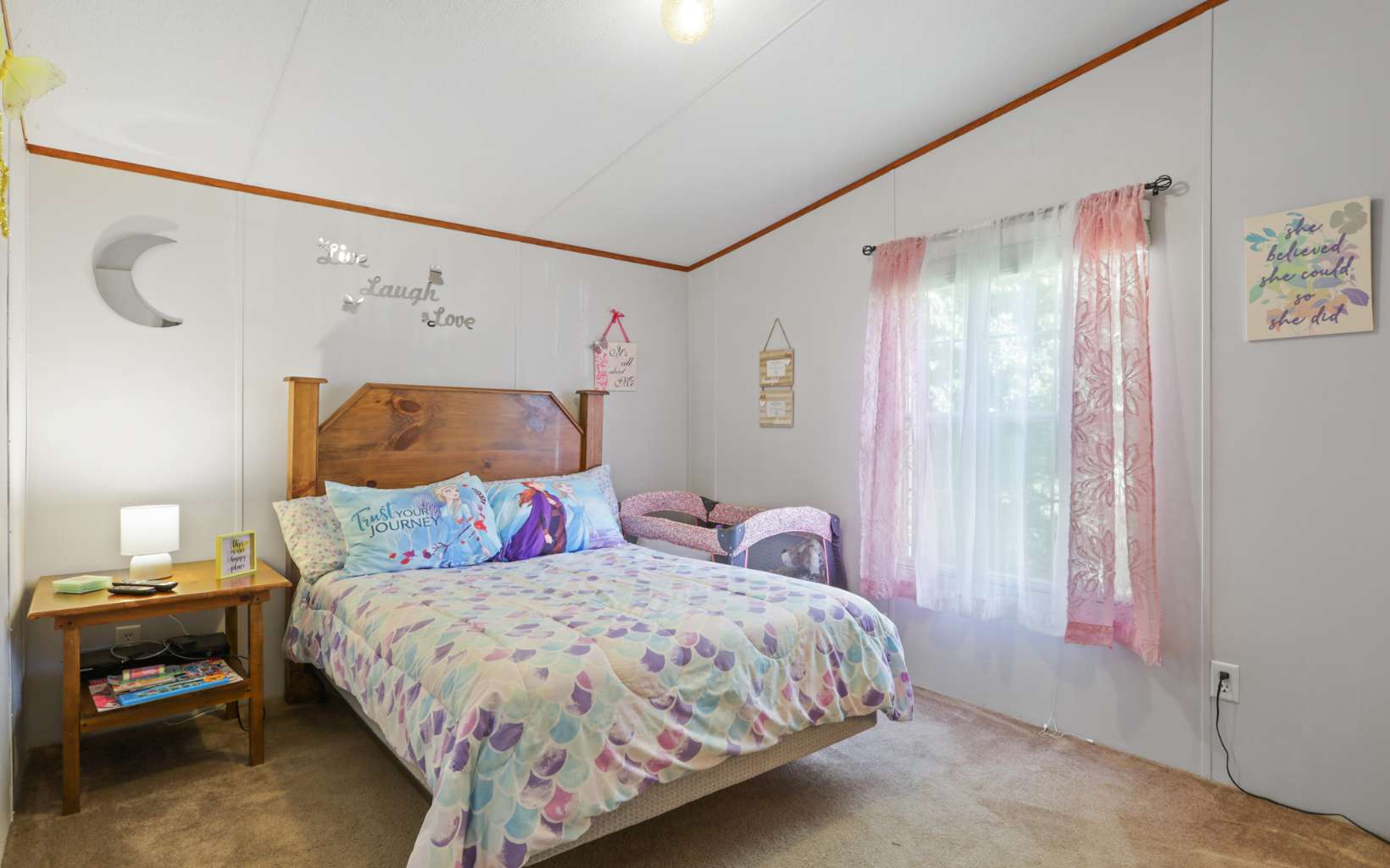 611 Wash Wilson Road Blue Ridge, GA 30513 - Photo 21 of 26 a bedroom with a bed and a window
