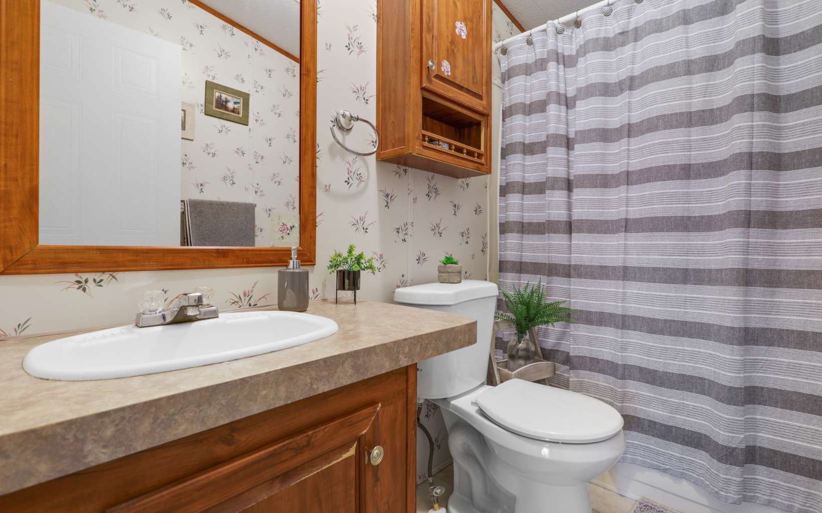 611 Wash Wilson Road Blue Ridge, GA 30513 - Photo 23 of 26 a bathroom with a sink and a mirror