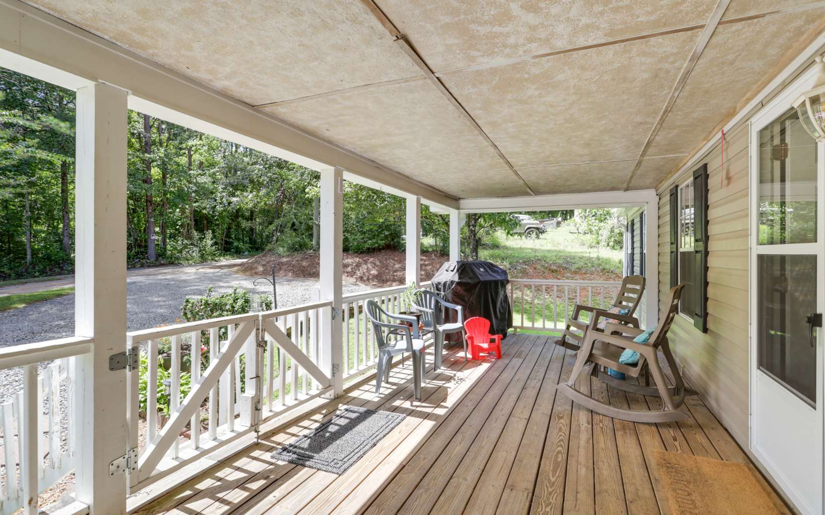 611 Wash Wilson Road Blue Ridge, GA 30513 - Photo 4 of 26 a view of a balcony with couch and wooden floor