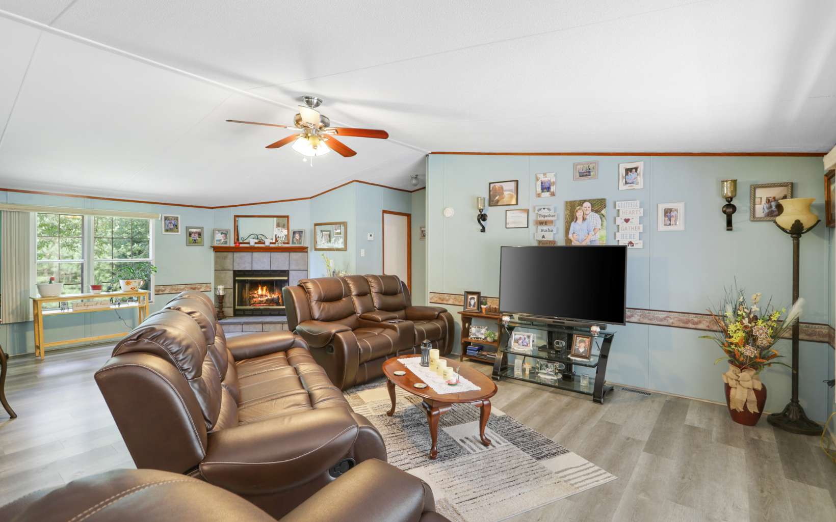 611 Wash Wilson Road Blue Ridge, GA 30513 - Photo 8 of 26 a living room with furniture a flat screen tv and a window