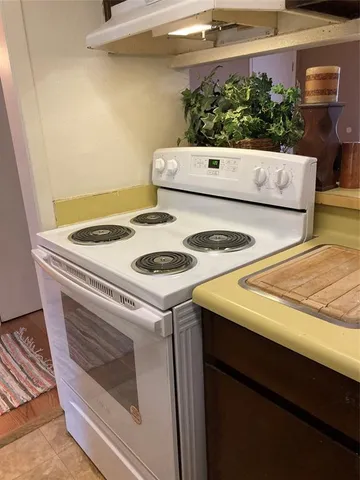 a view of a bathroom with a tub and shower