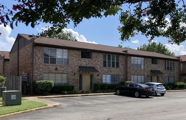 a car parked in front of a building