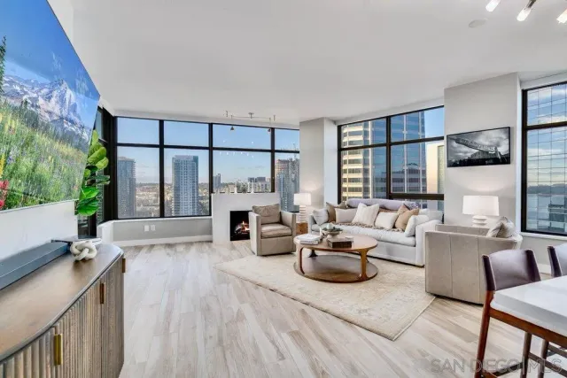 a living room with furniture and a large window