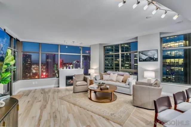 a view of city from balcony with furniture