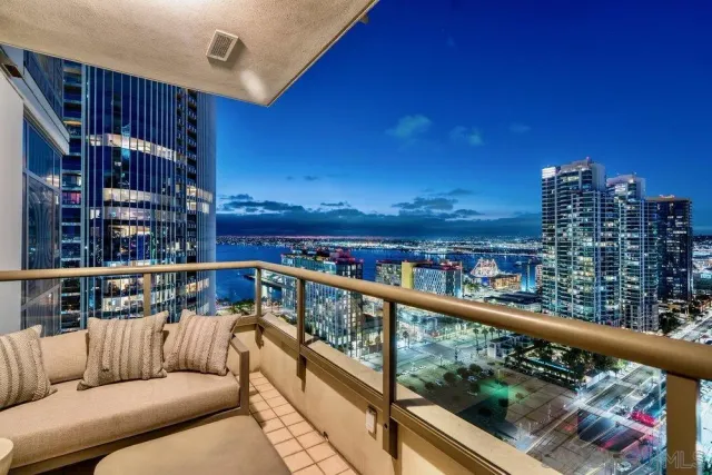 a kitchen with a sink a stove and chairs