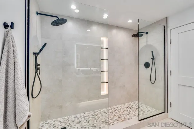 a bedroom with a large bed and a large window