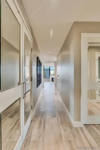 a kitchen with granite countertop a sink stove and cabinets